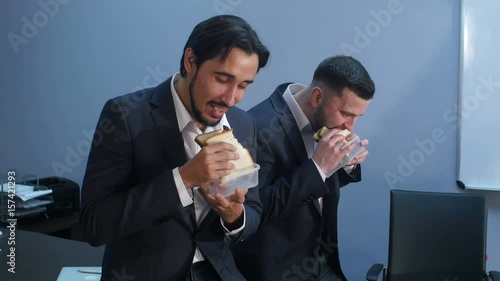 Office workers have a break from work to eat second breakfast photo