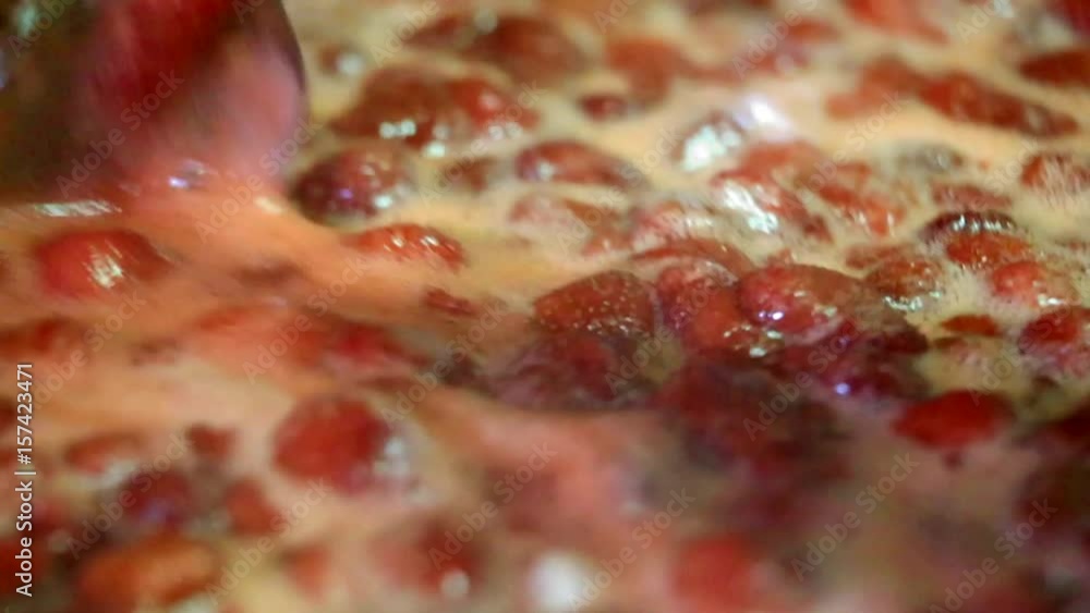 Cooking delicious strawberry jam closeup Cooking delicious strawberry jam closeup