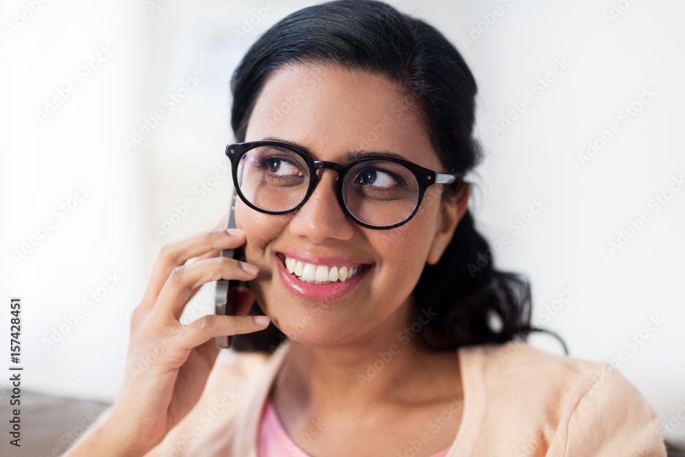happy indian woman calling on smartphone at home happy indian woman calling on smartphone at home