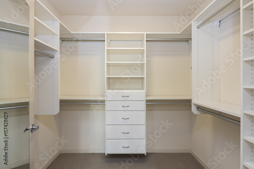 Front view of empty closet space on bedroom photo