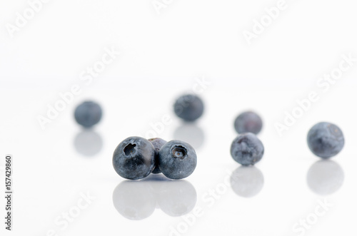 Blueberries Closeup On White Background With Reflection