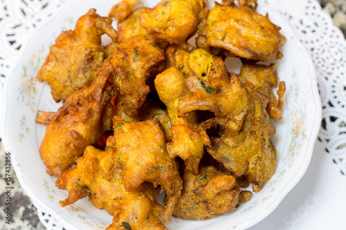 Crispy onion pakora or bhajis or pakoda, popular fried Indian snack for Ramadan iftar photo