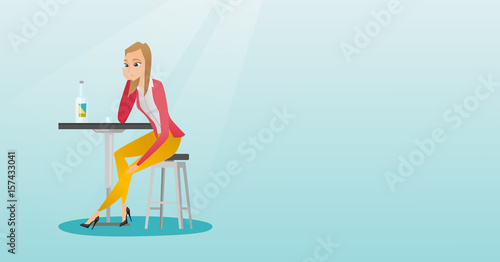Woman drinking a cocktail in the bar.
