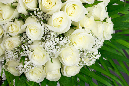 Elegant bouquet of lots of white roses
