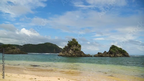 Seascape with beach, rocks and wave, sky, clouds, rocks, ocean. Puraran. 4K video Philippines Catanduanes 4K video Travel concept photo