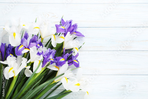 Fototapeta Naklejka Na Ścianę i Meble -  Bouquet of iris flowers on white wooden table
