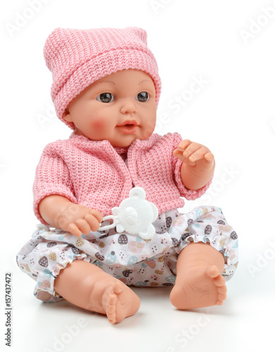 Toy doll child, in pink blouse with pacifier on isolated background