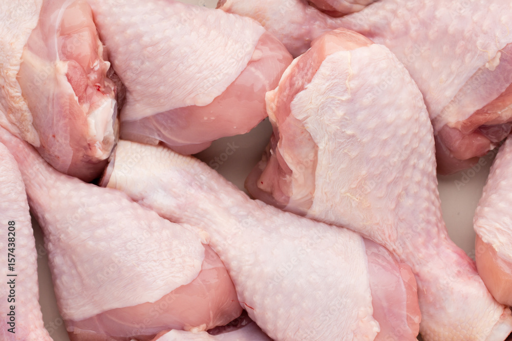 Fresh chicken leg,  meat on plate.With spices.