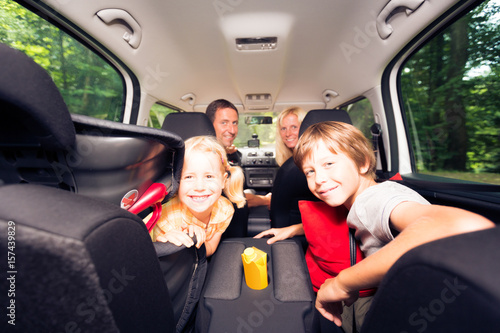 Family Sitting Inside Their Car