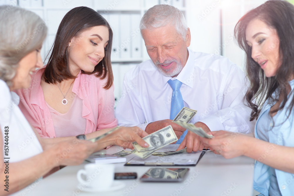 Four businessmen working together Four businessmen working together