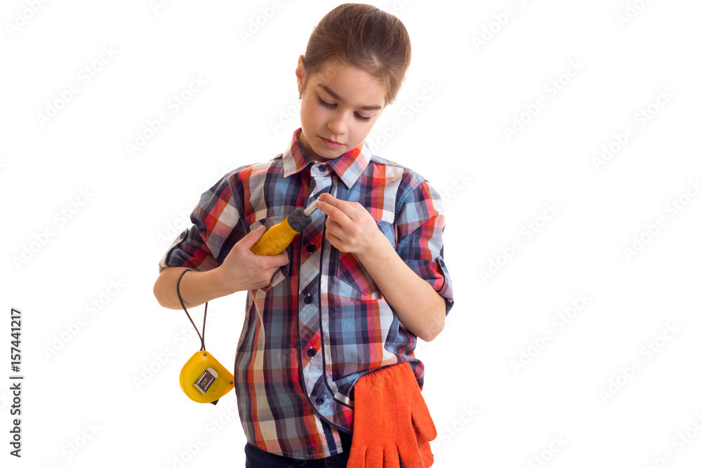 Little girl holding screwdriver and roulette Little girl holding screwdriver and roulette