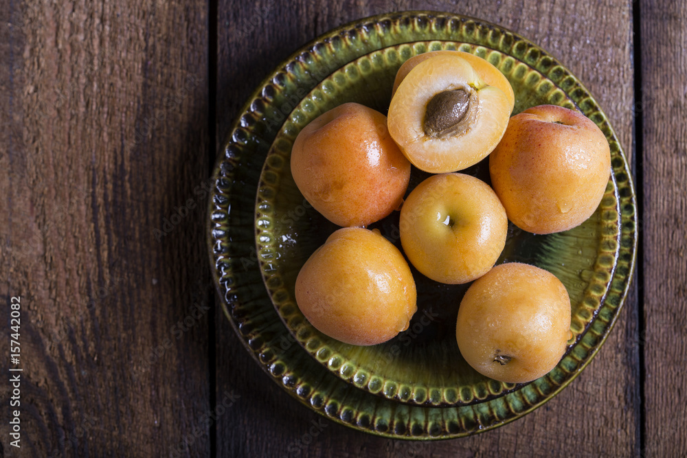 Fresh apricots on wooden table Fresh apricots on wooden table