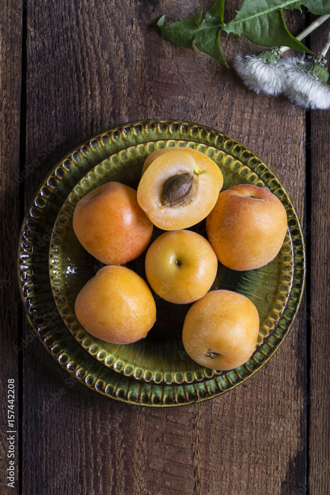 Fresh apricots on wooden table Fresh apricots on wooden table