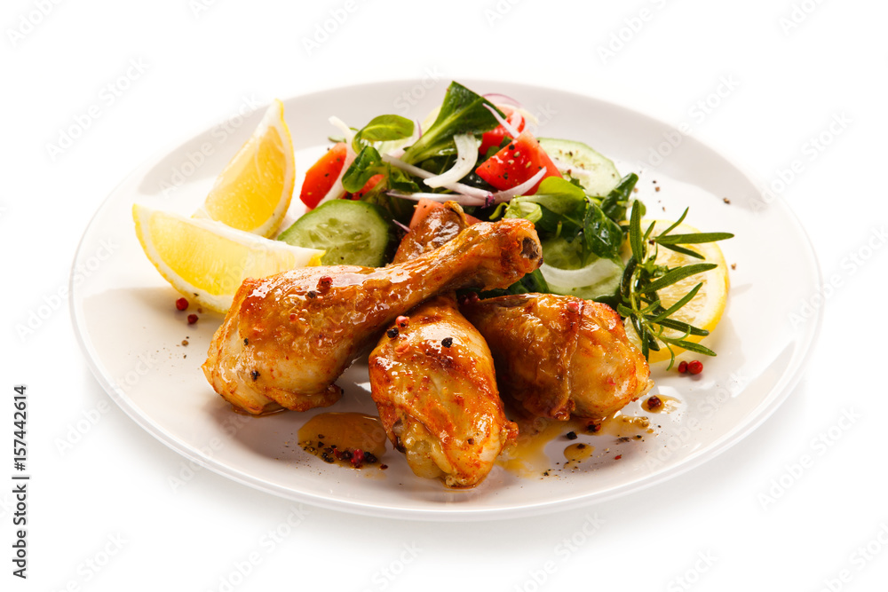 Roast drumsticks on white background