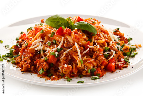 Spaghetti bolognese on white background