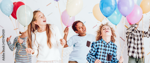Smiling children with balloons