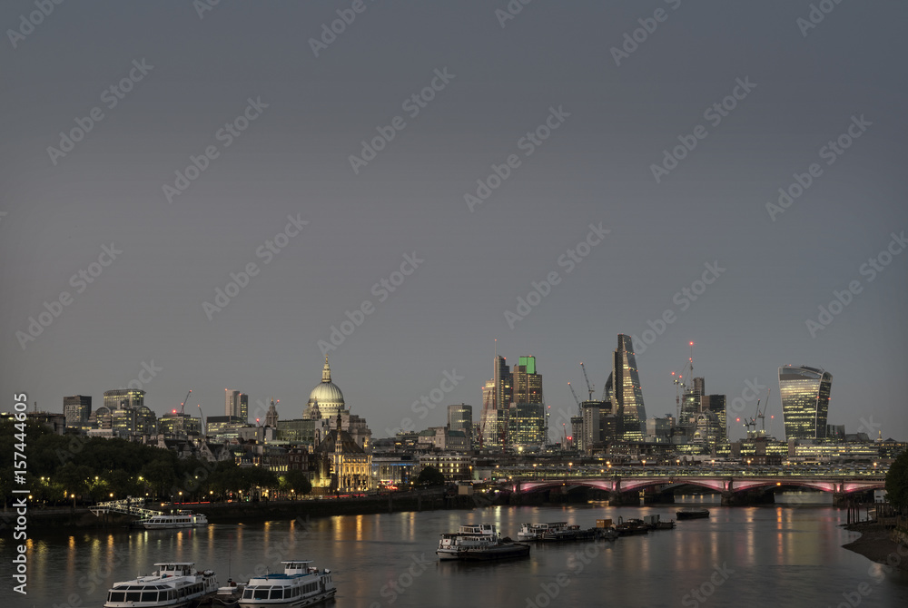skyscrapers in london city with st paul's cathedral at night seen over thames river skyscrapers in london city with st paul's cathedral at night seen over thames river
