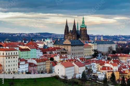 View of Prague and Prague castle from Petrin hill at sunset with dramatic sky. Czechia