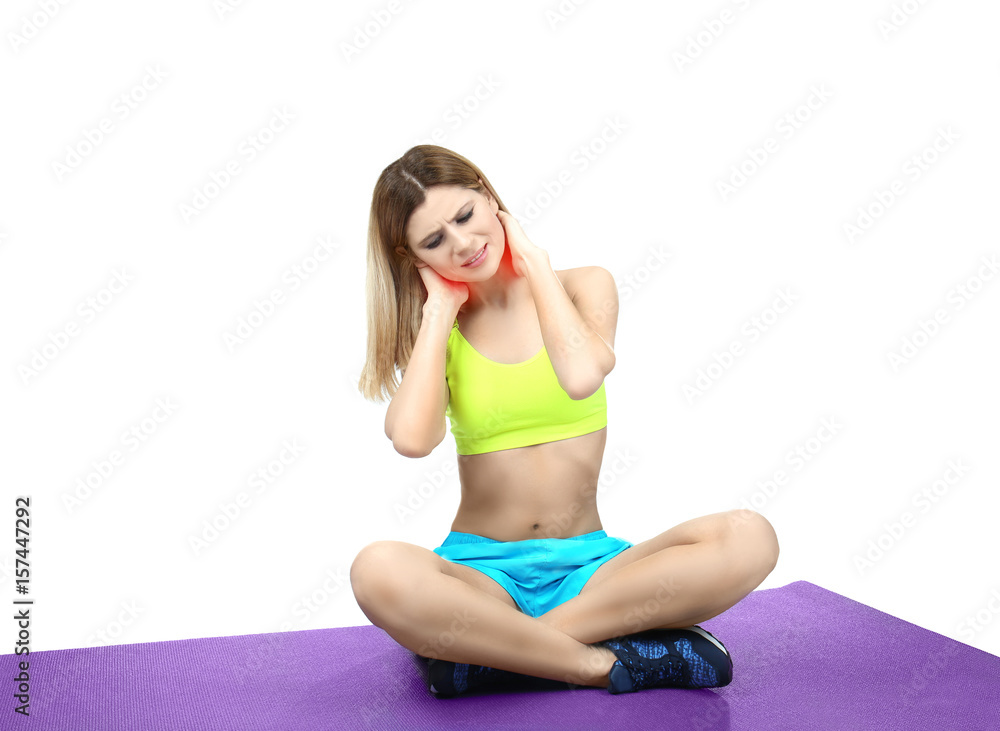 Young sporty woman suffering from neck pain on white background Young sporty woman suffering from neck pain on white background