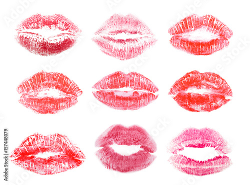 Different lipstick prints of women lips on white background photo