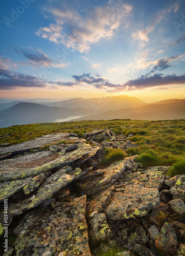 Rocks on the mountain field during sunrise. Beautiful natural landscape in the summer time