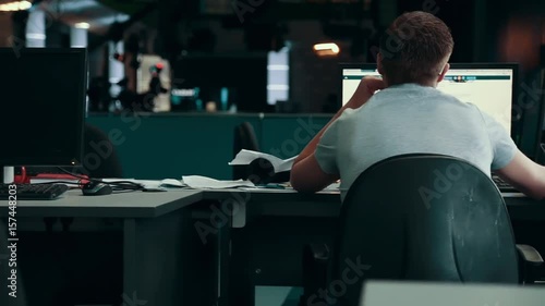 A journalist working on a computer in Newsroom