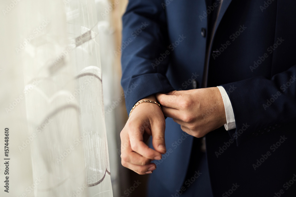 Obraz premium Businessman wears a jacket.Politician, man's style,male hands closeup, American, European businessman, business, fashion and clothing concept