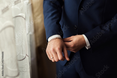 Businessman wears a jacket.Politician, man's style,male hands closeup, American, European businessman, business, fashion and clothing concept
