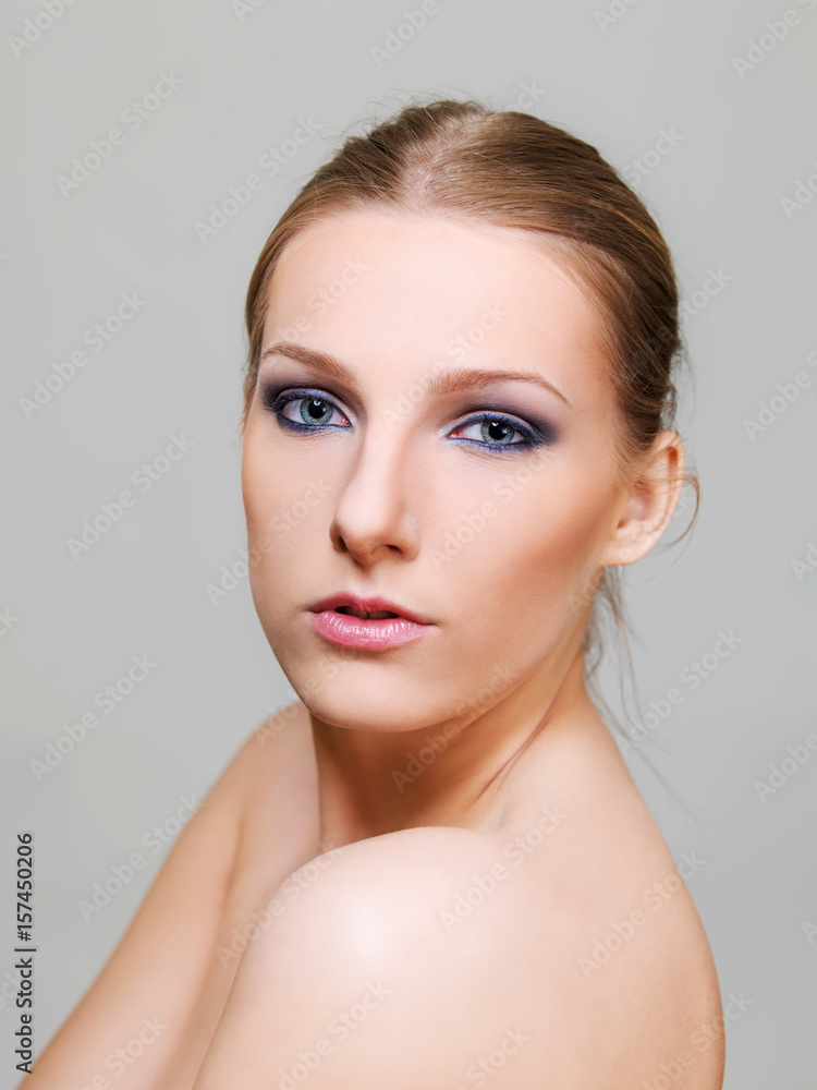 Attractive blonde topless woman with dark eye make up Attractive blonde topless woman with dark eye make up