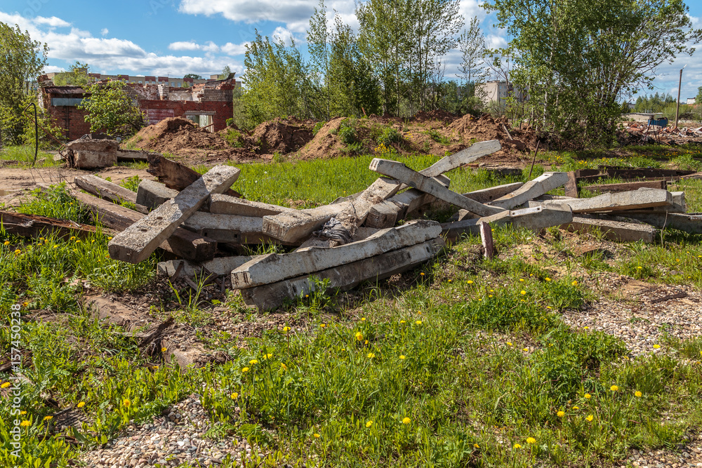 Remains of concrete pillars piled into the pile Remains of concrete pillars piled into the pile