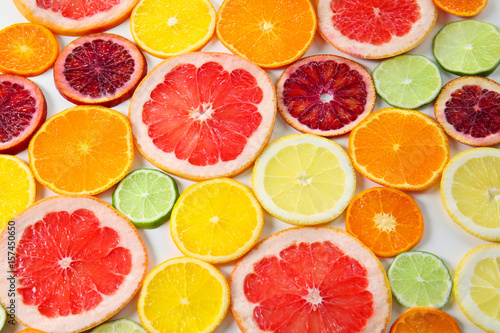 Juicy slices of citrus fruits, closeup