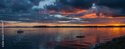pastel sunset over water with floating dock © Leslie C Saber