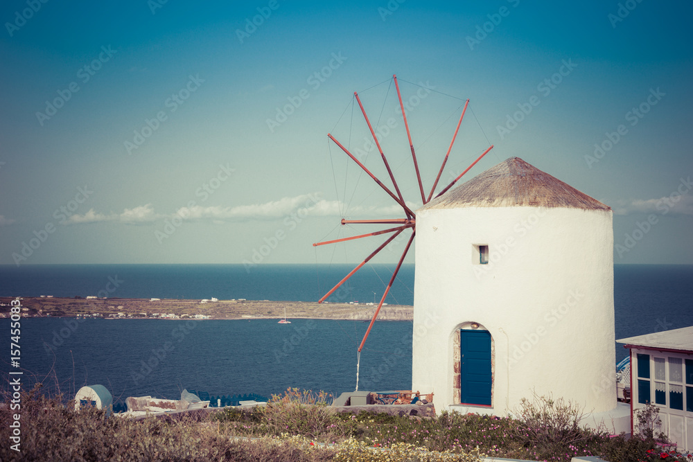 Windmill on Santorini island, Greece. Typical Aegean and cycladic architecture.