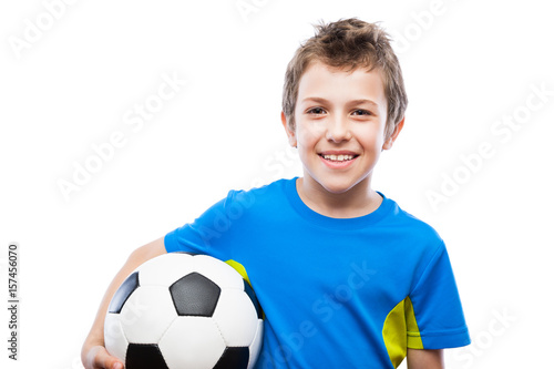 Handsome smiling child boy holding soccer ball