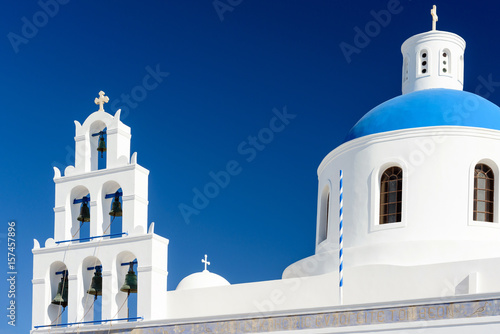 Bell tower and dome of Panagia Platsani in Oia, Santorini, Greece