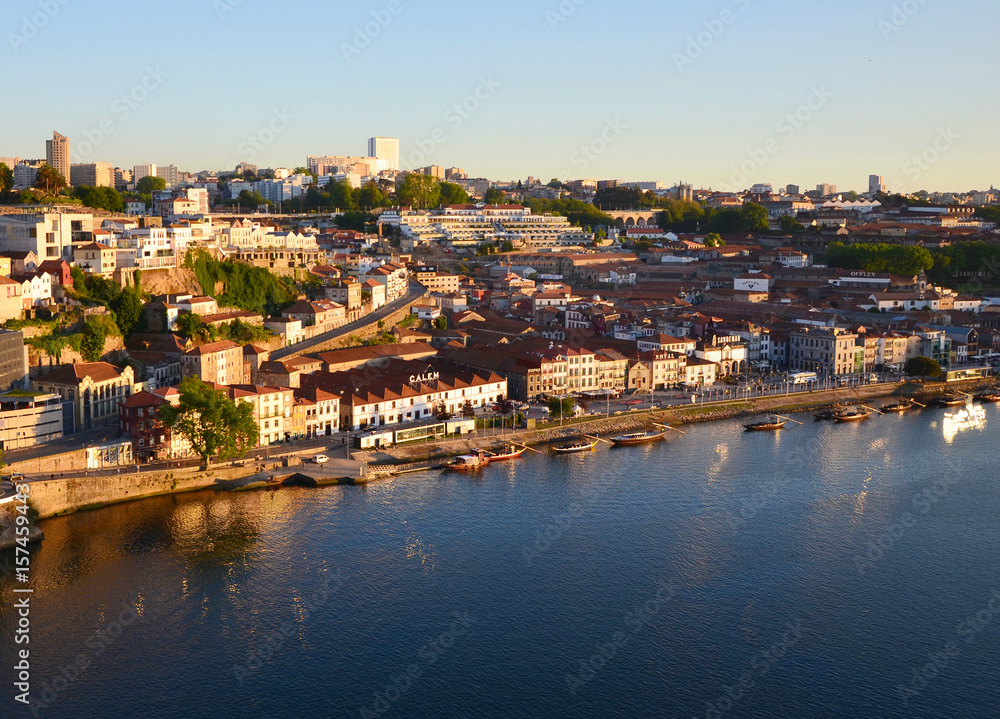 Reflection of the sun at river Douro and city during Sunset, seen from Ponte Luis at Sunset - Porto, Portugal