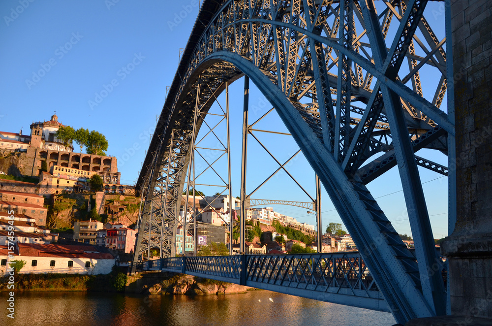 Reflection of the sun at river Douro and city during Sunset, seen from Ponte Luis at Sunset - Porto, Portugal