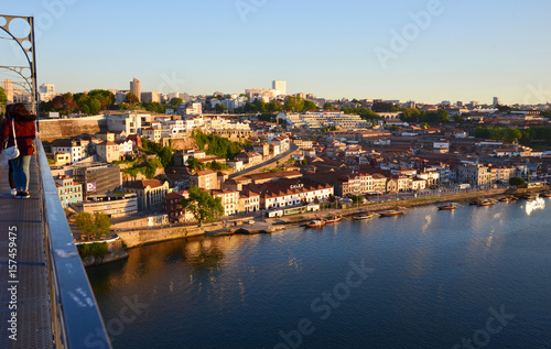 Reflection of the sun at river Douro and city during Sunset, seen from Ponte Luis at Sunset - Porto, Portugal