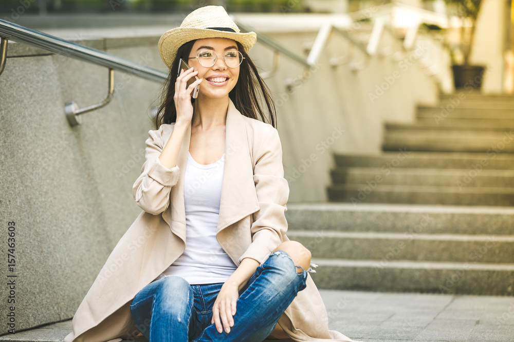 Beautiful young Business Woman using phone. Slow Motion. Beautiful woman in jeans enjoying sunny morning in the city. Lens Flare. Beautiful young Business Woman using phone. Slow Motion. Beautiful woman in jeans enjoying sunny morning in the city. Lens Flare.