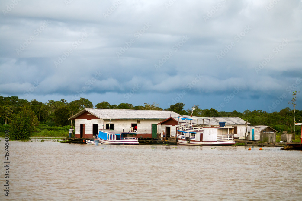 Floating houses in amazon river - Manaus - Brazil Floating houses in amazon river - Manaus - Brazil