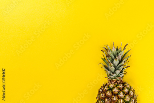 Half slice of beautiful fresh appetizing tasty pineapple on yellow bright background. Top View. Horizontal. Copy Space. Conceptual.