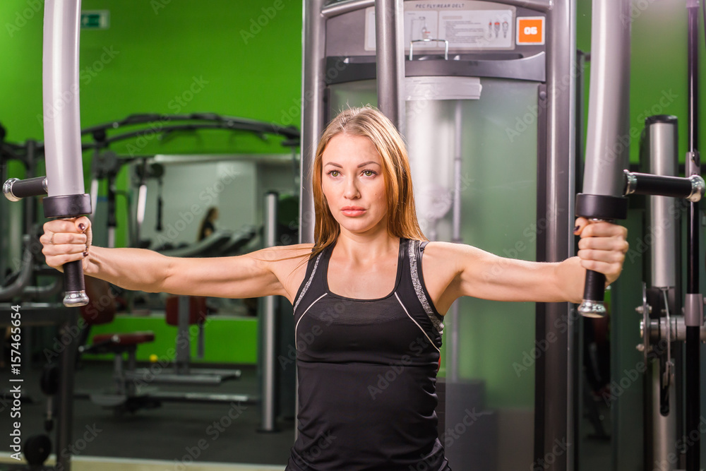 beautiful muscular fit woman exercising building muscles beautiful muscular fit woman exercising building muscles