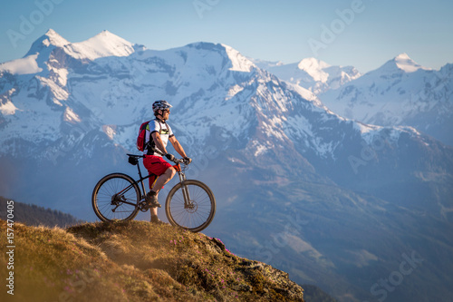 Male mountainbiker enjoying the view in the mountains