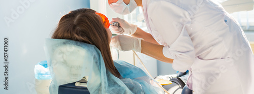 Young woman getting dental treatment. dental clinic. photo