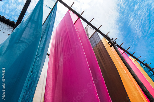Tableau sur toile colorful fabric hanging to dry after traditional dye process,shot in Heng Dian Town,Zhejiang province of China