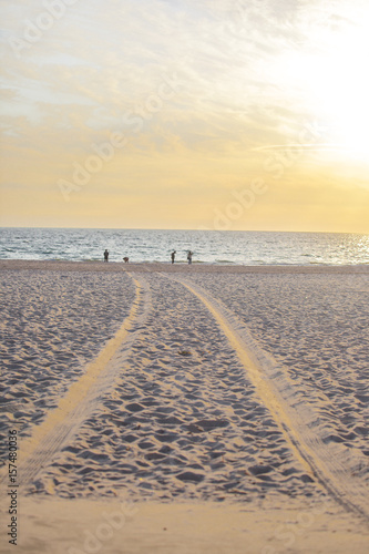 The evening beach near the sunset is a time when people like to go out to do various activities.