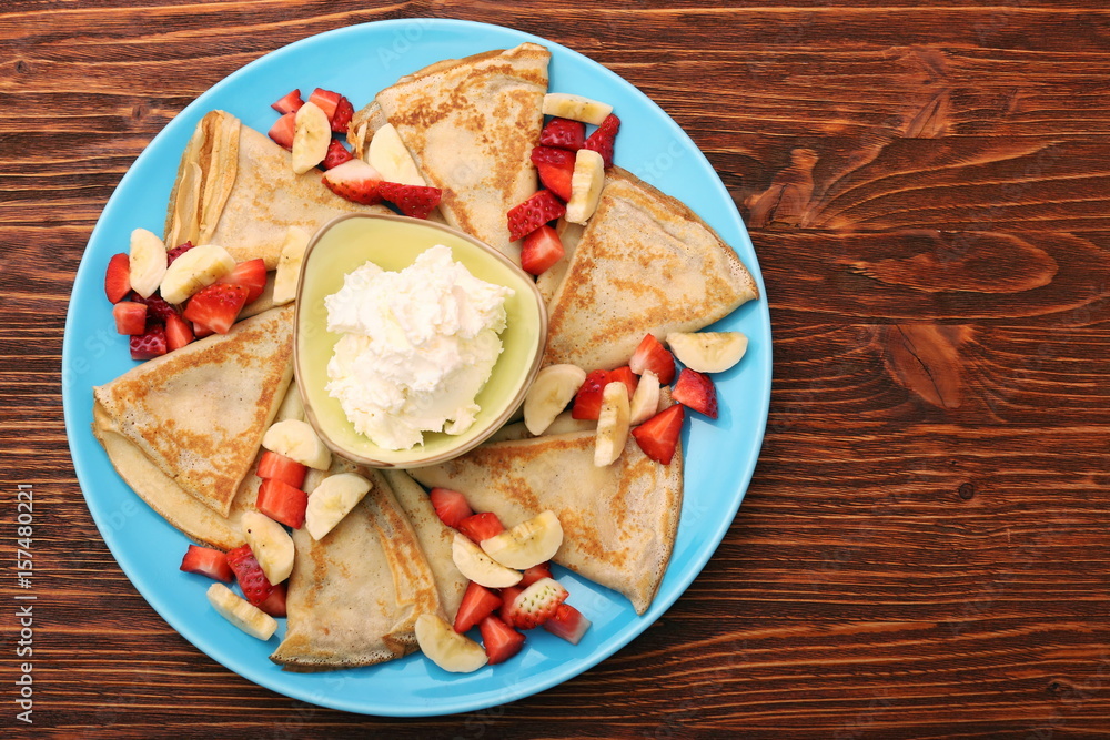 Delicious pancake with sliced of strawberry and banana Delicious pancake with sliced of strawberry and banana
