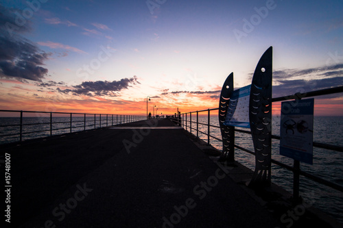 sunset on the bridge at Glenelg beach photo