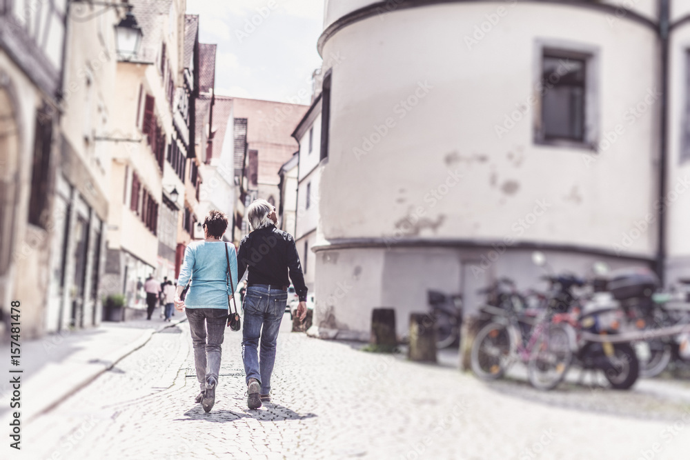 Senior Couple Walking Through The Streets Of Tuebingen