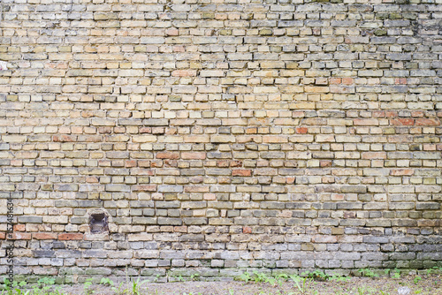 colorful abandoned grunge cracked brick stucco wall background